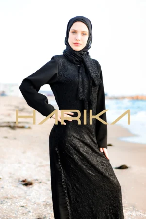 Black silk crepe dress adorned with lace details