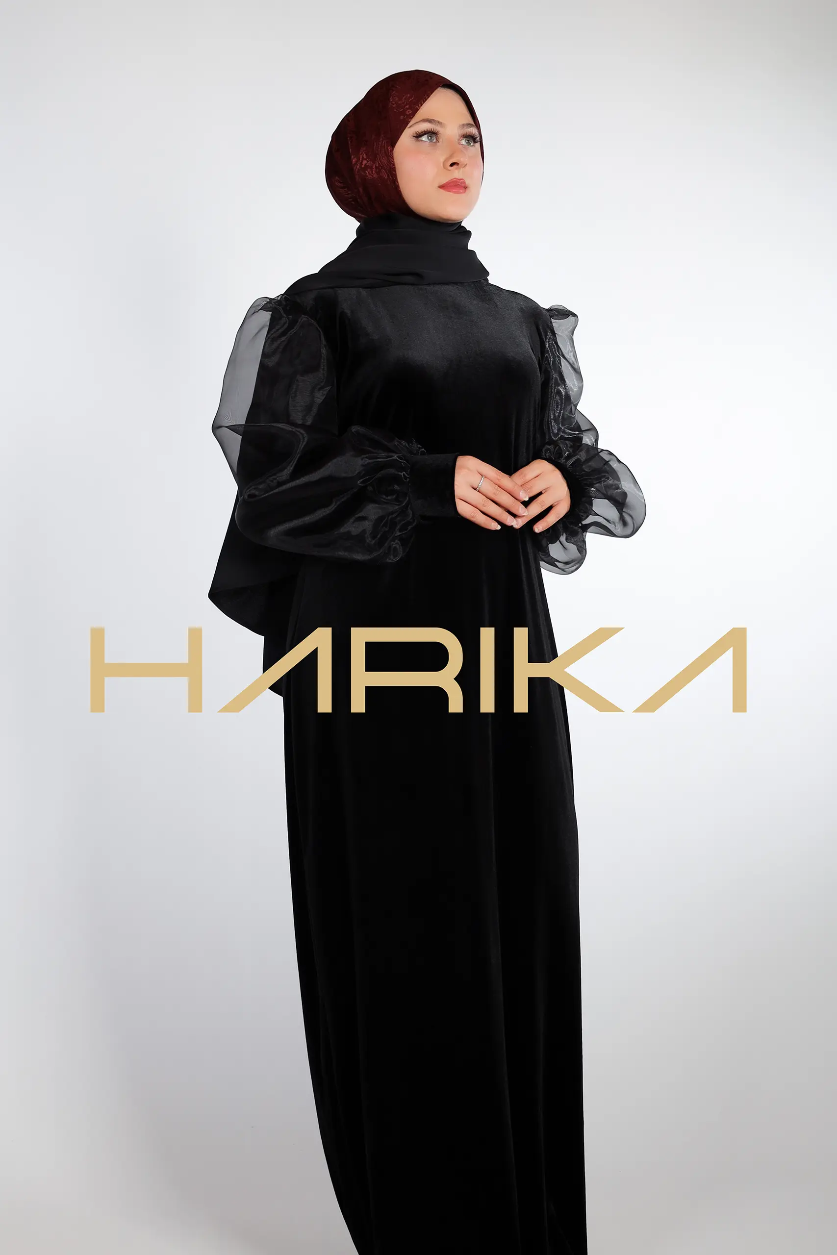 Elegant black velvet dress with organza sleeves
