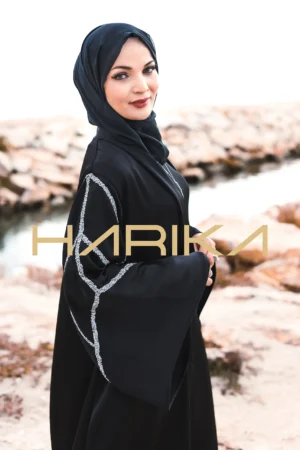 A black wide-sleeved abaya adorned with crystal