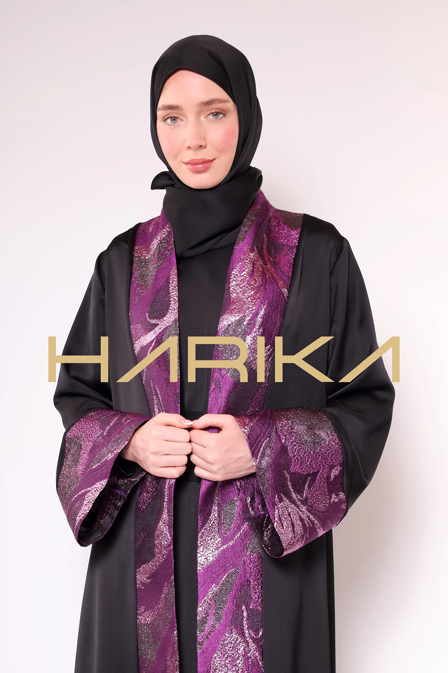 A luxurious silk crepe abaya with purple brocade detailing